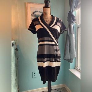 Women’s sweater dress, above the knee.